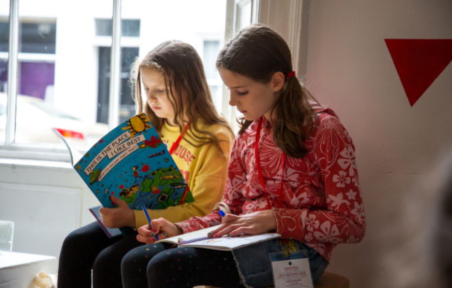 Two members of the Baboró Children's Panel at the Galway Arts Centre in 2021
