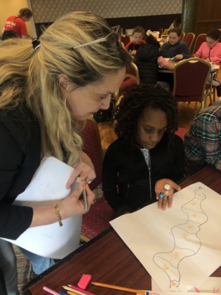 A young game designer talks through her ideas with Brenda.
